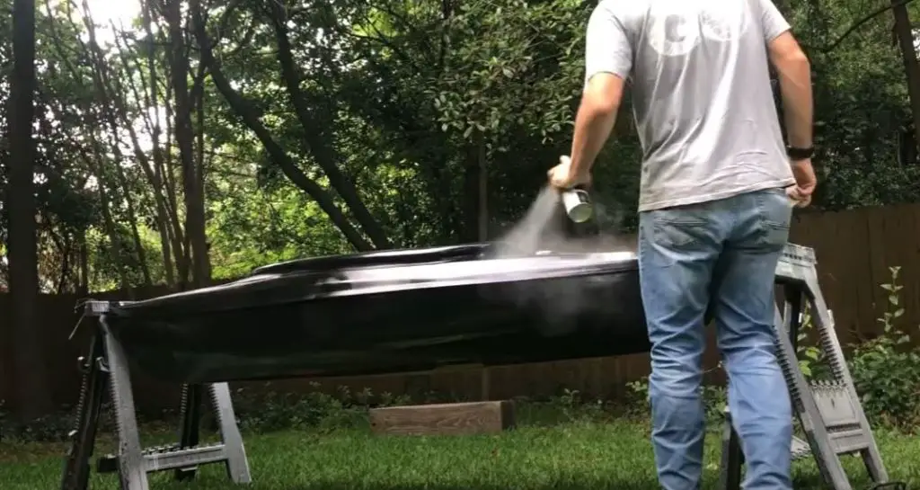 Painting a kayak with spray paint