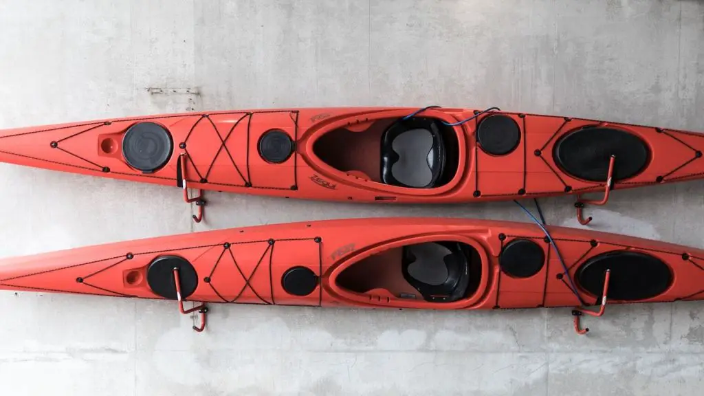 Wall-mounted kayak storage