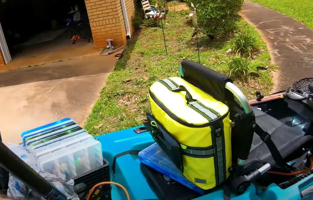 Carry a cooler on the kayak behind your seat