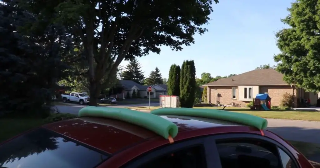 Pool noodle roof rack to transport your kayak on a small car