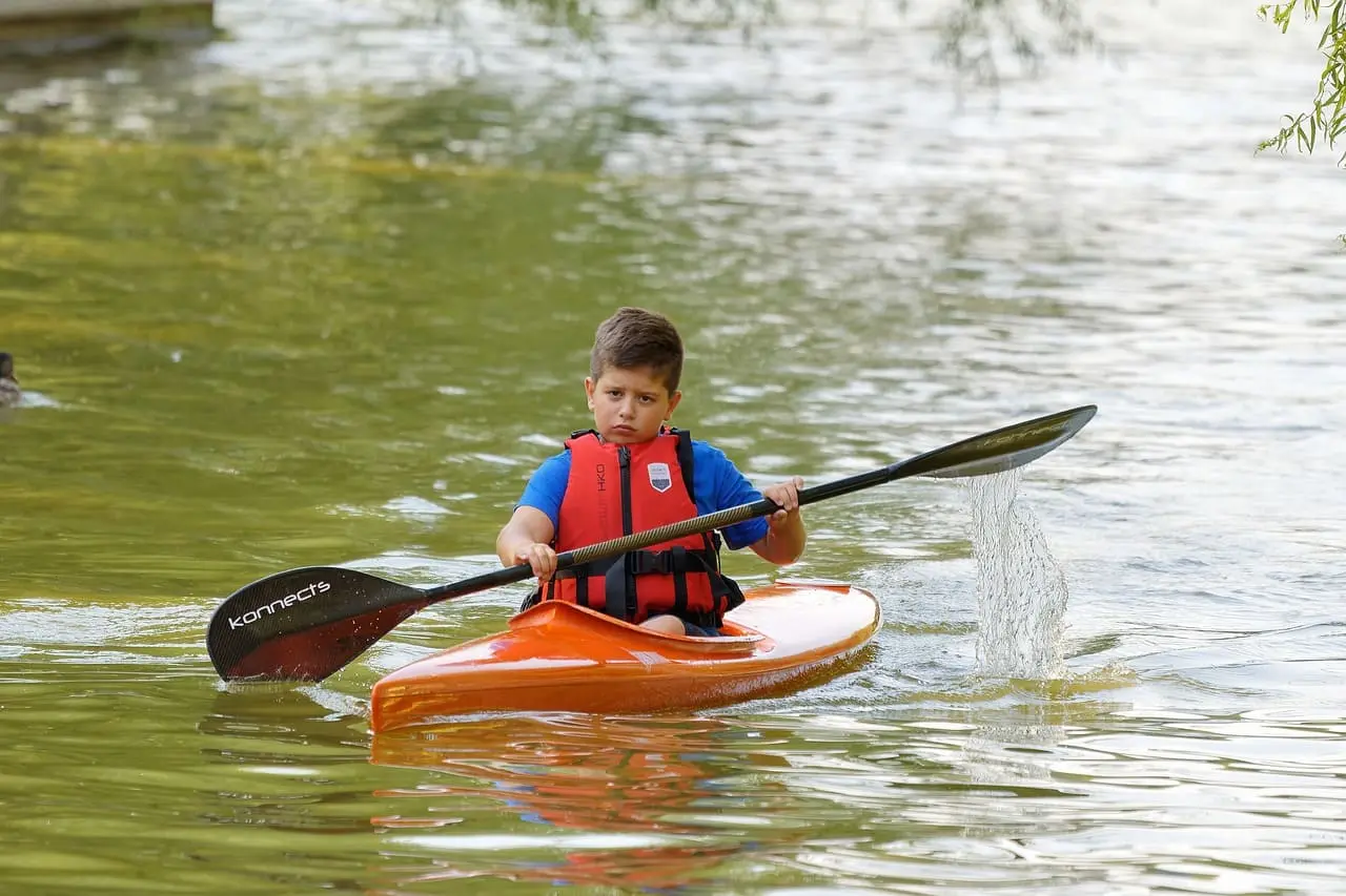 Boy kayaking on the river